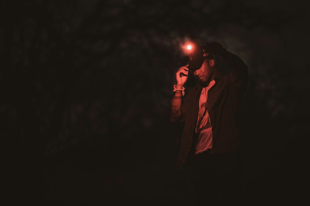 detective with flashlight